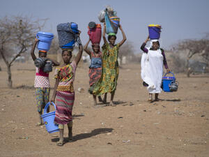 Malian refugees collect aid items at Goudoubo camp, Burkina Faso, February 2020.