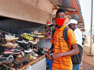 Angola. Market in Lovua settlement provides refugees with food and supplies