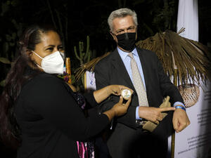 UN High Commissioner for Refugees Filippo Grandi meets Venezuelan entrepreneur Jazhilmar Baez at an event in Quito, Ecuador.