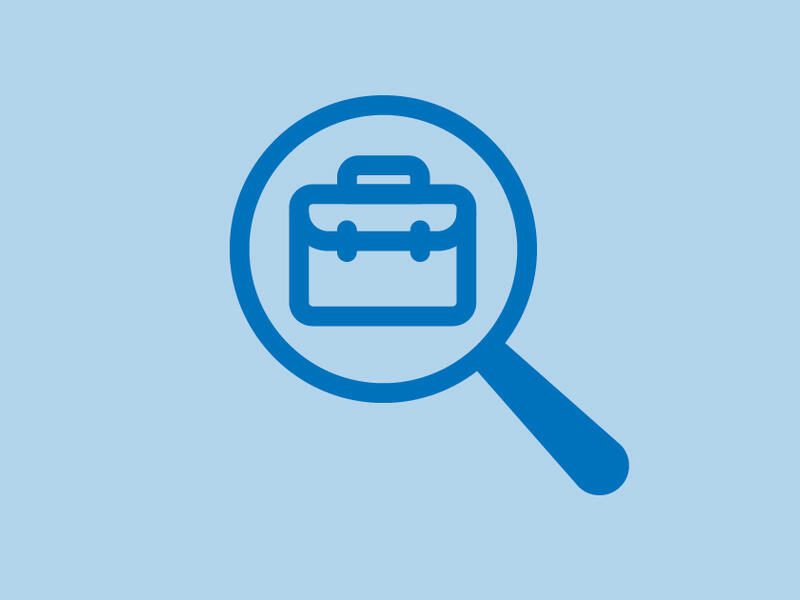 An icon of a briefcase under a magnifying glass 