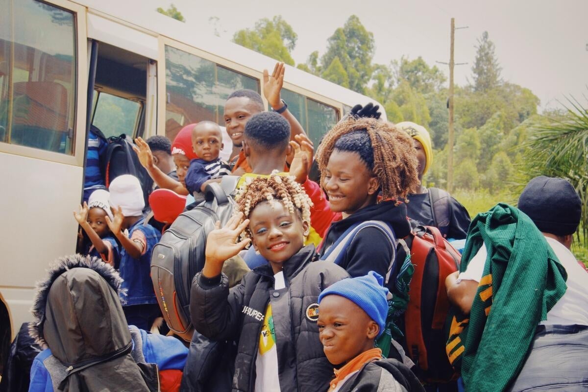 Tanzania. Resettlement families are boarding the bus from the Transit Center in Kasulu town to Kasulu airstrip