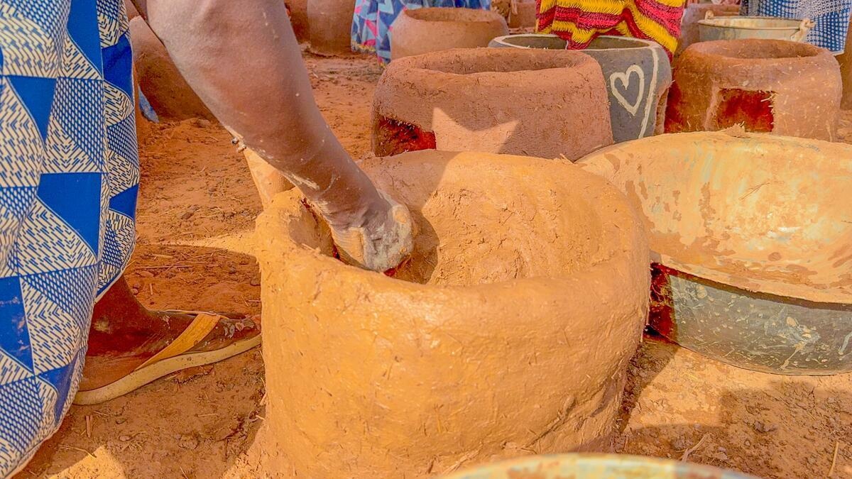 Burkina Faso. Internally displaced women making improved cooking stoves in Kaya