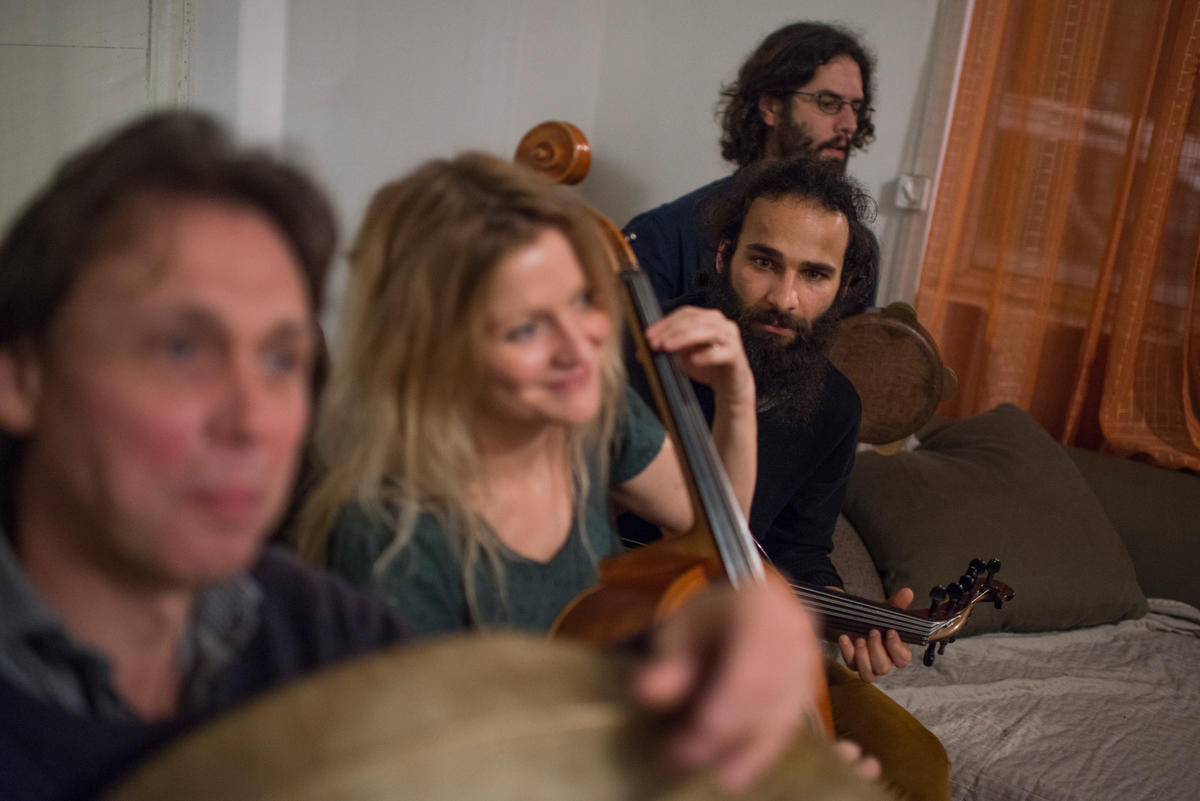 Belgium. An iraki refugee playing lute.