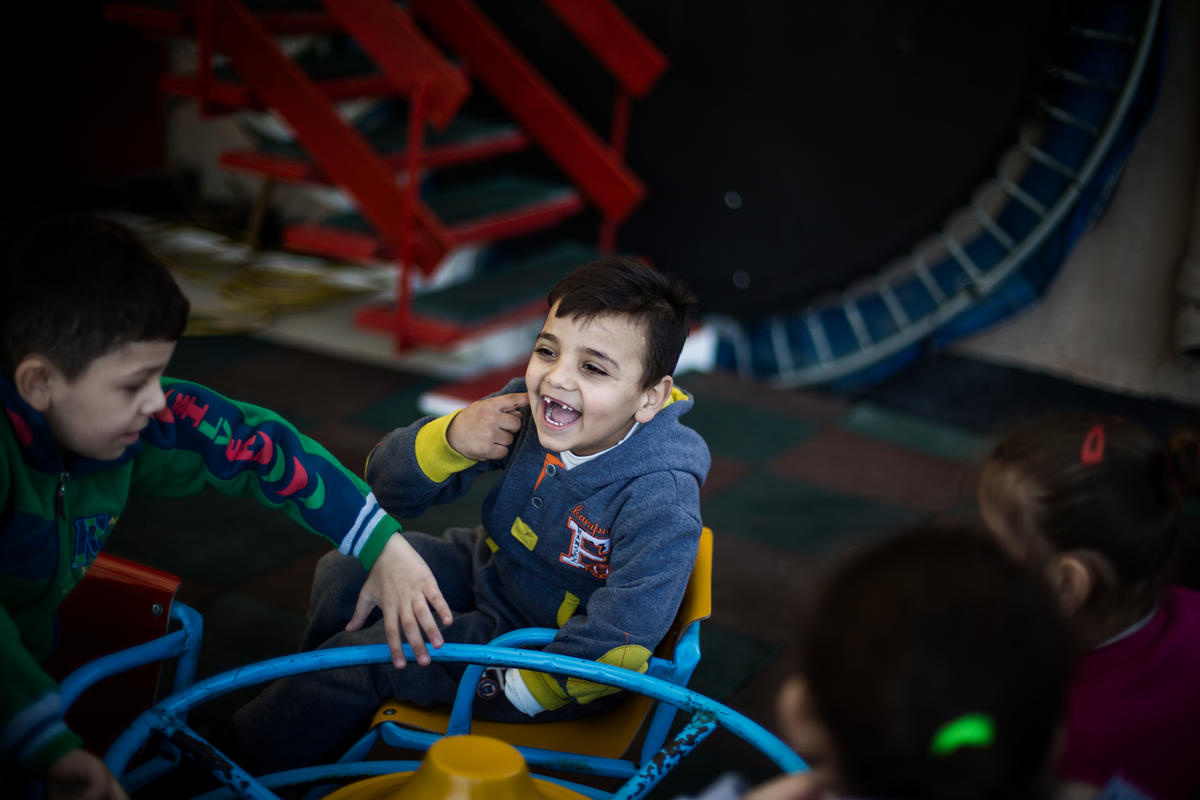 Mohammad, a young Syrian refugee from the ancient desert city of Palmyra, plays with classmates during a break at the Father Andeweg Institute for the Deaf (FAID) on the outskirts of Beirut in Lebanon.