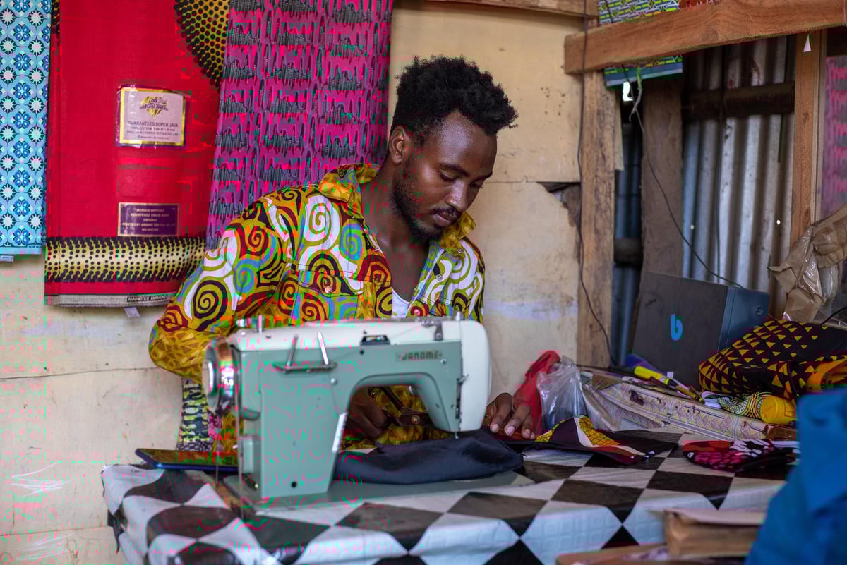 Somalia. Refugees make masks 