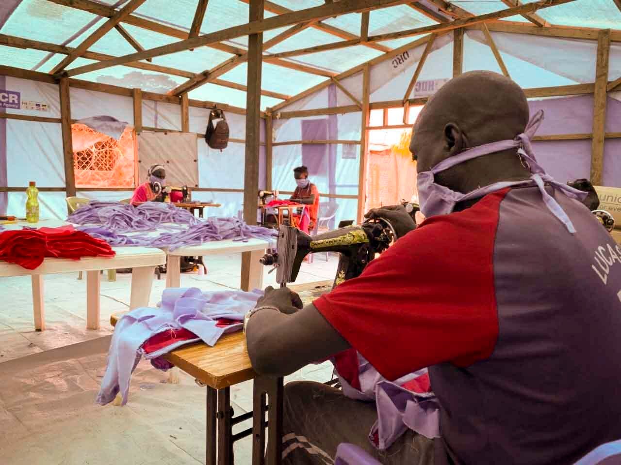 South Sudan. Refugees make masks