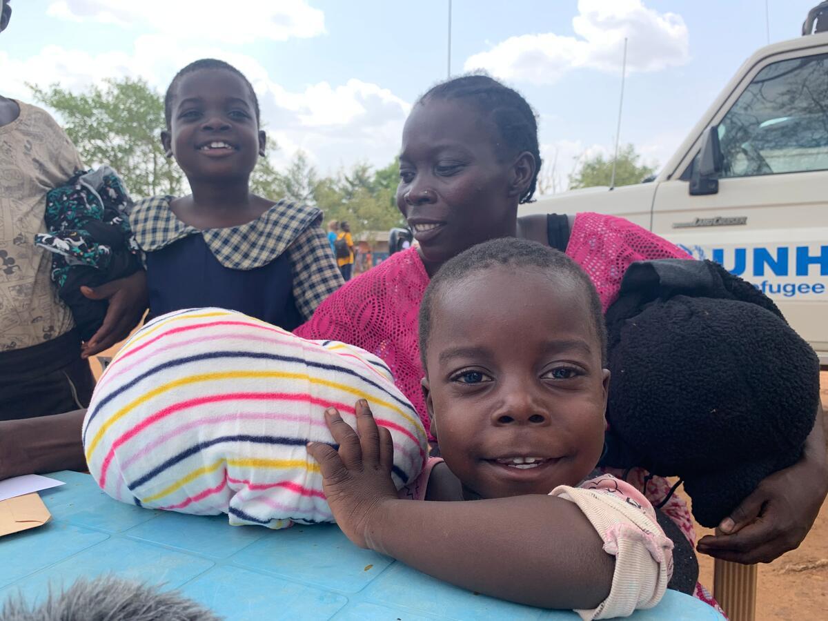 South Sudan. Clementina and her family receive new clothes