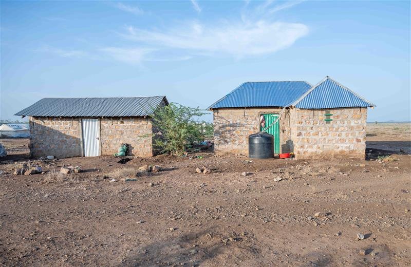 Due to her large family, Bahati received support to build two shelters, providing safe, adequate space for all 11 of her children.