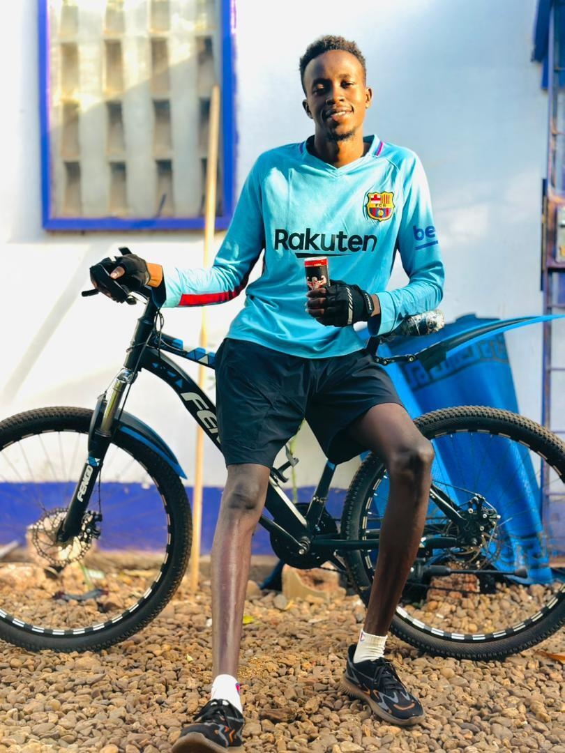 Central African Republic. Sudanese refugee and DAFI scholar Abdallah Abdelrahman Saleh with his bike in Bangui