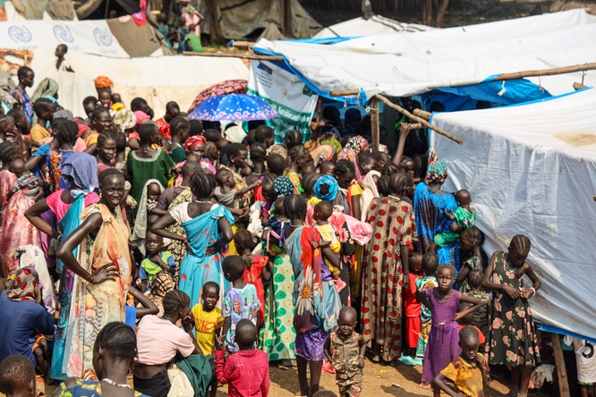 South Sudanese refugee women gather outside a nutrition center in Matar, Gambella, waiting to receive critical assistance. 
