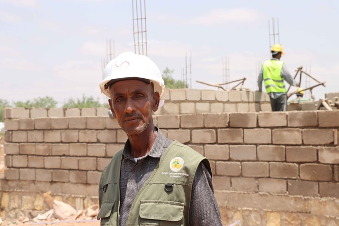 Mohamed at the construction site where he now works as a foreman supervisor.