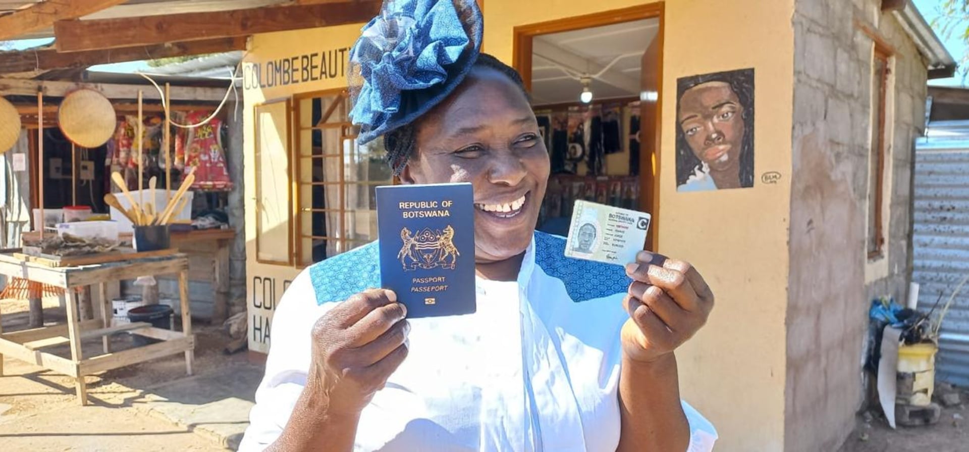 Joyce holds her newly issued Botswanan passport after decades living as a refugee.