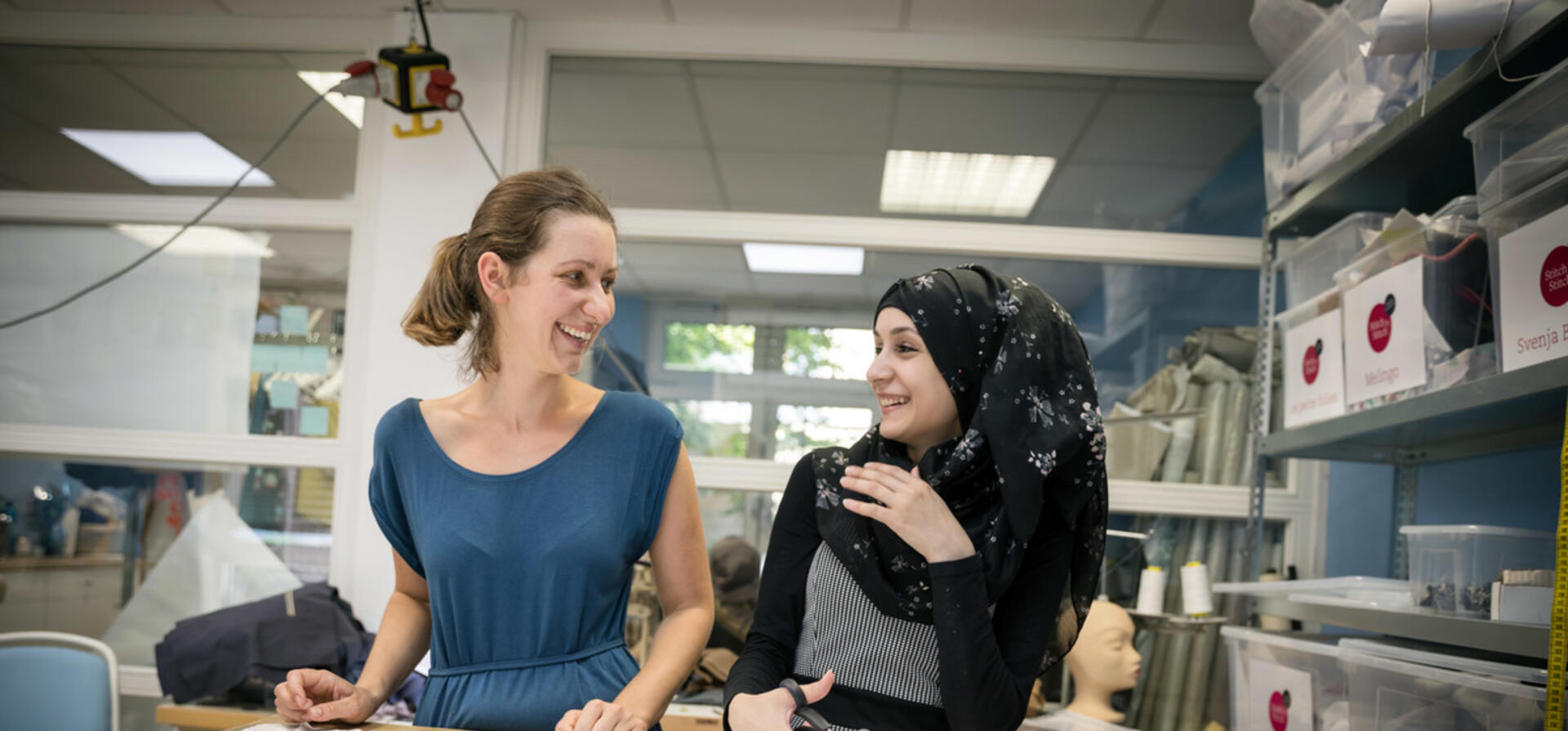 Germany. Refugee women got a job as a seamstress in a Frankfurt fashion workshop.