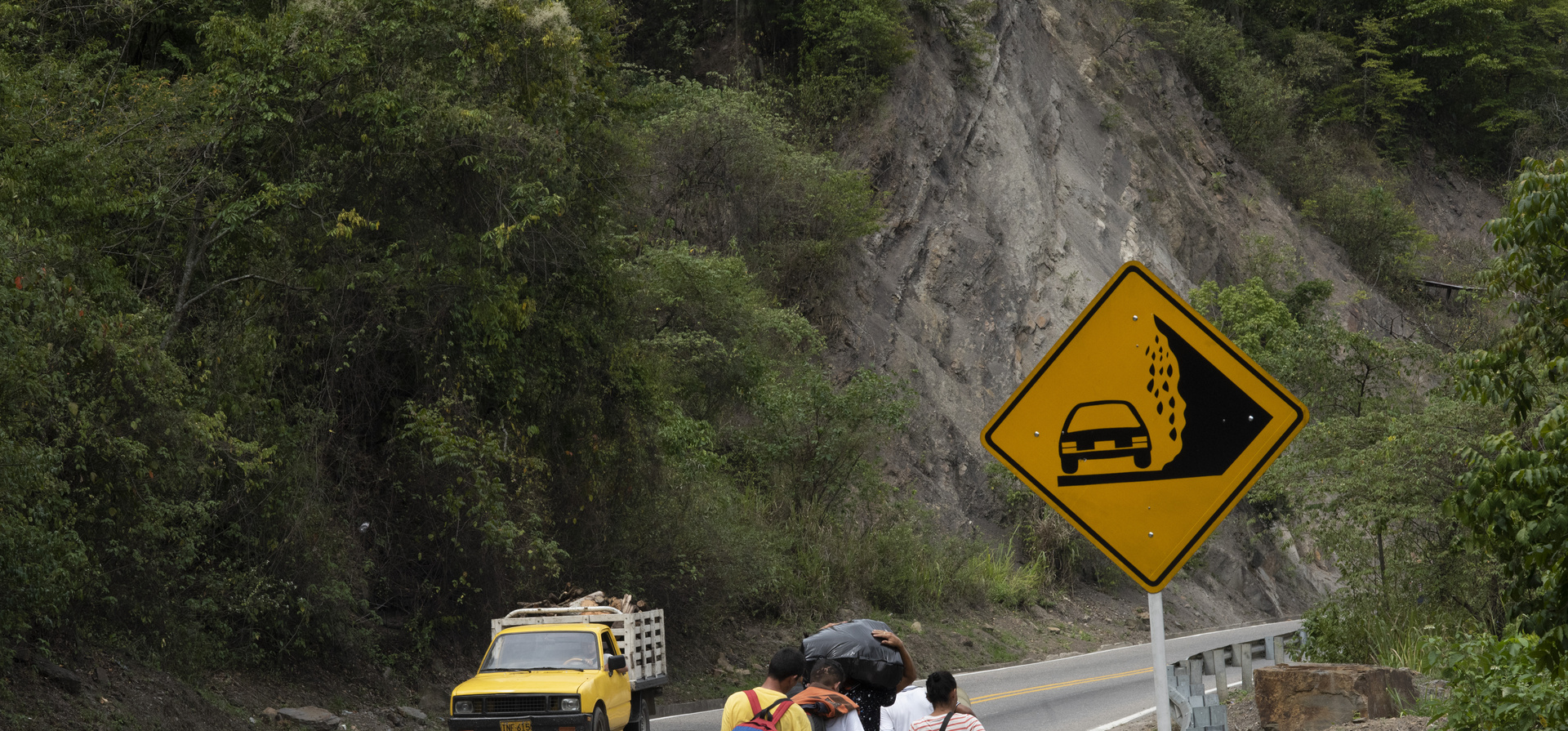 A group of Venezuelans trek along a busy highway between Cúcuta and Pamplona, Colombia. 