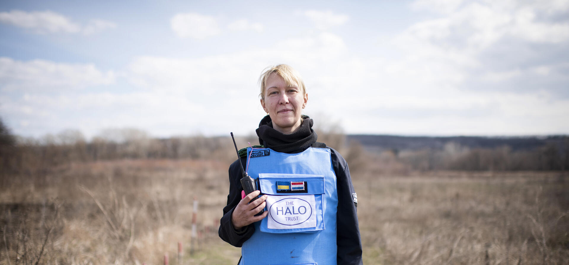 Ukraine. A female deminer in partially cleared minefield in the Donbas area