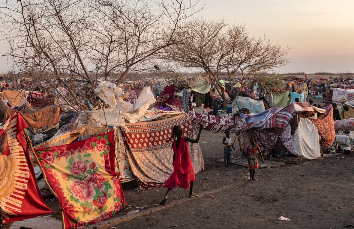 Children play near a makeshift camp.