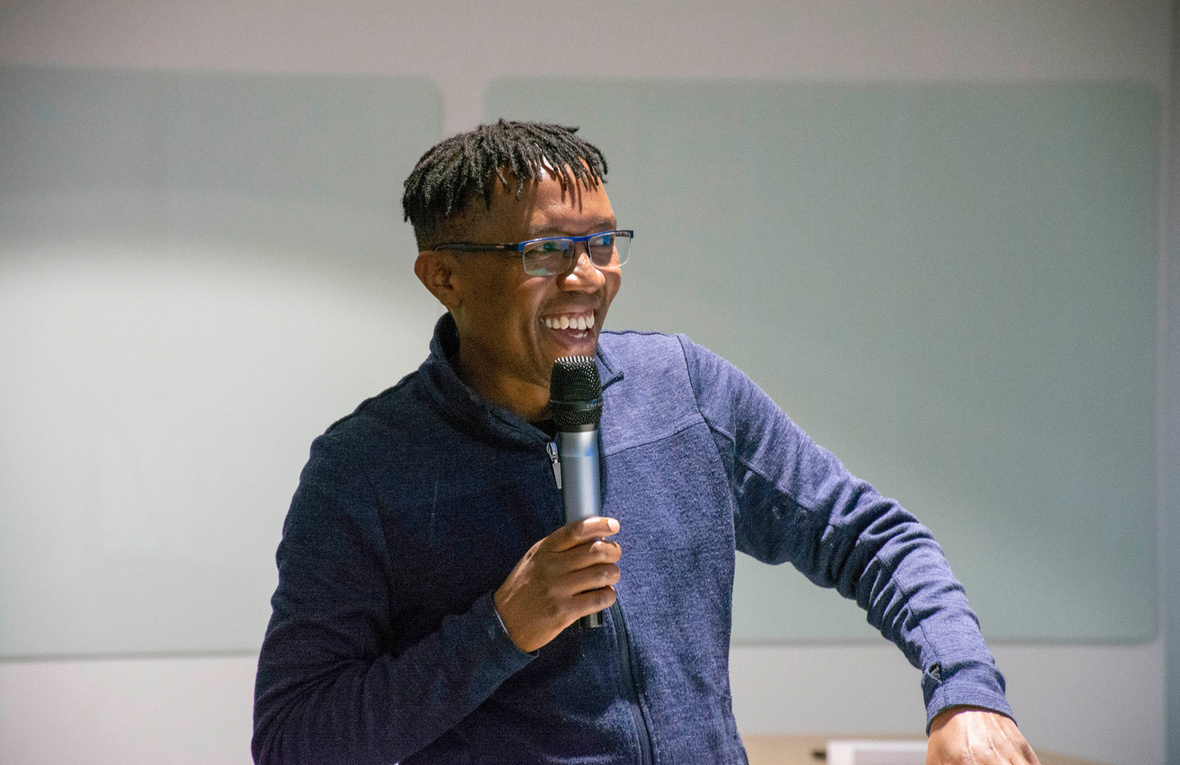 Ben Safari, head of UNHCR's Supply Management Service, talks into a microphone.