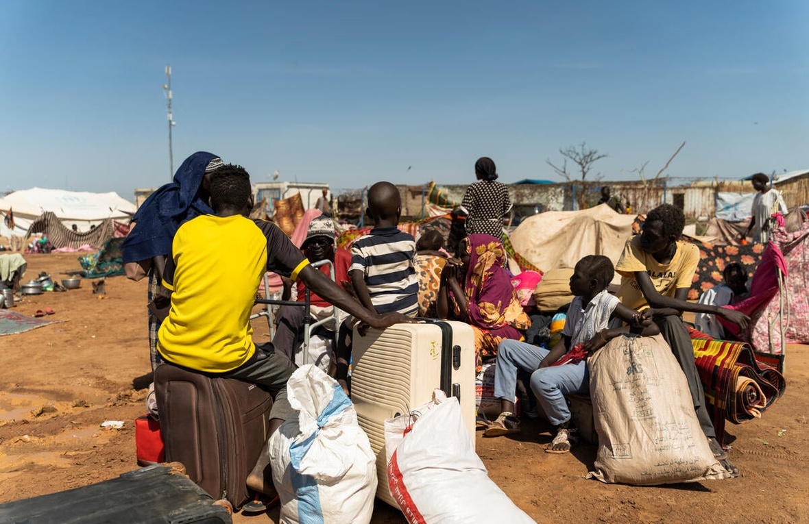 Refugees from Sudan wait at the Joda border point in South Sudan's Upper Nile State for transportation to the transit centre in Renk. 