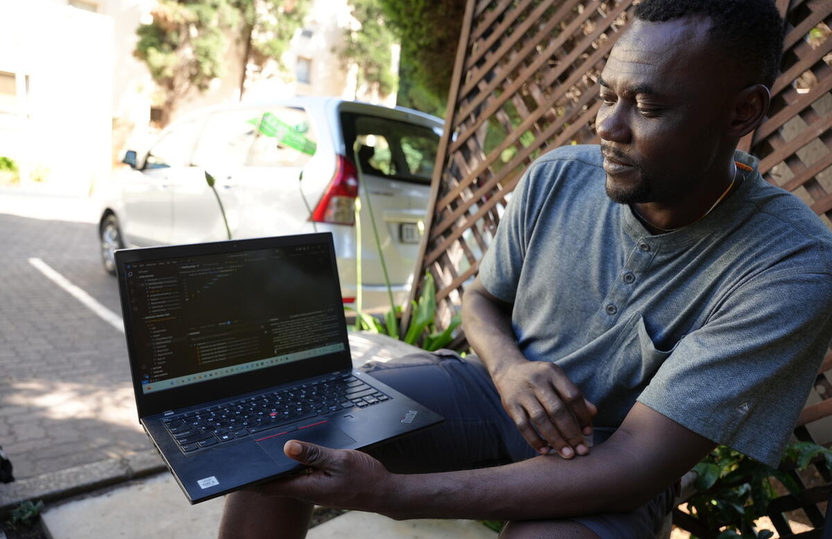 South Africa.  Congolese refugee returns home to rebuild his community with IT skills gained in South Africa