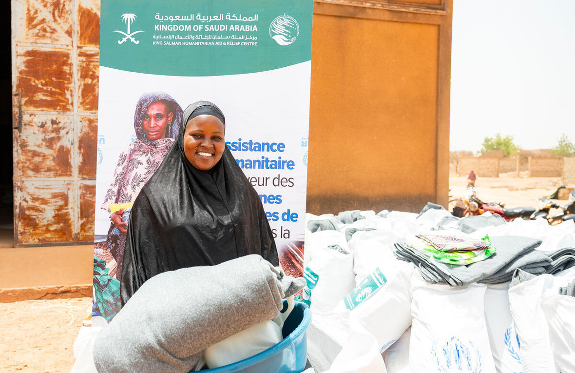 Burkina Faso. Odile Ouédraogo, an Internally Displaced Person (IDP), receives a core relief kit in the Yaadga region