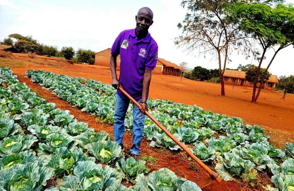 Tanzania. Ephrahim Nyandwi, a teacher and environmental advocate, works in the school garden at Mapendo Secondary School in Nyarugusu Refugee Camp