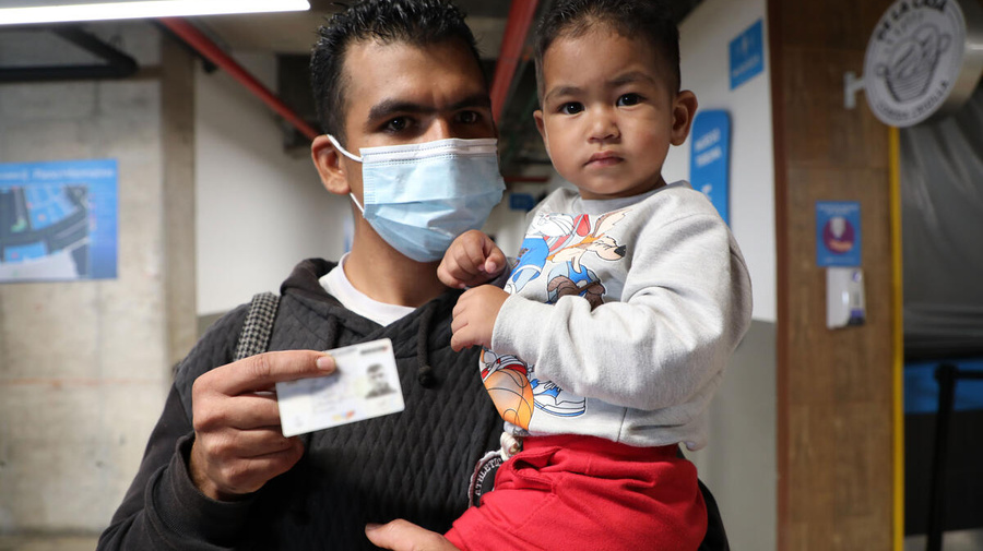 Colombia. Baby Tahiner receives his Temporary Protection Permit