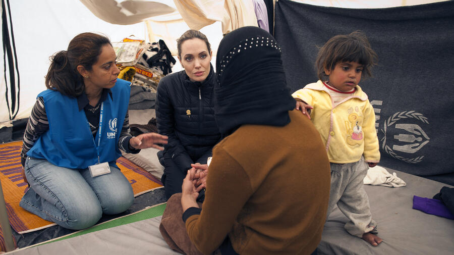 UNHCR Special Envoy Angelina Jolie meets with refugees at the Za'atri refugee camp in Jordan.