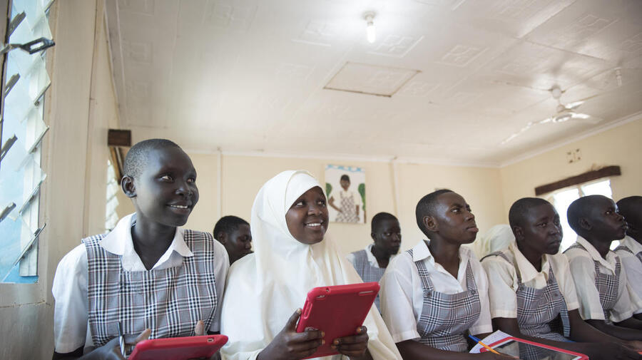 Kenya. Mary and Mumina use tablets in Class 8 at Angelina Jolie School