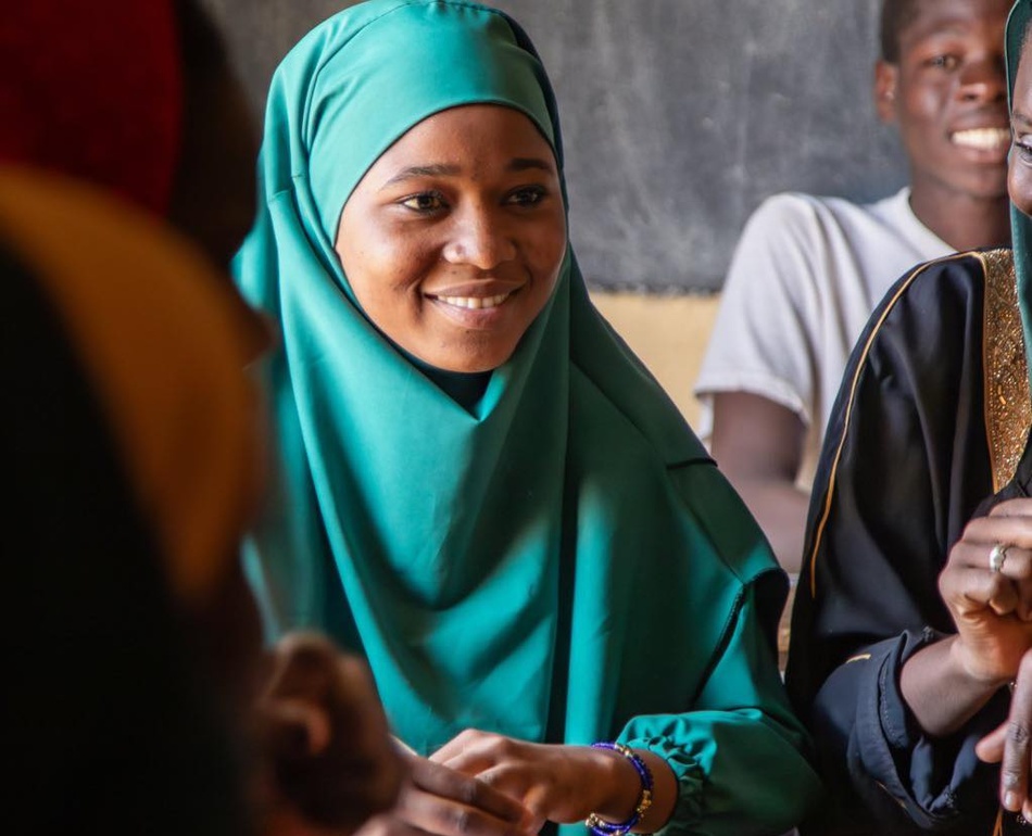 Hali attending a course in class.