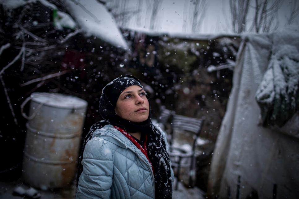A young Syrian refugee outside her home in an informal settlement camp in Beqaa Valley, Lebanon.  © UNHCR/Diego Ibarra Sánchez