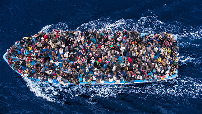 Italy/ Italian navy rescues asylum seekers traveling by boat off the coast of Africa on the Mediterranean, June 7, 2014./ Massimo Sestini for the Italian Navy