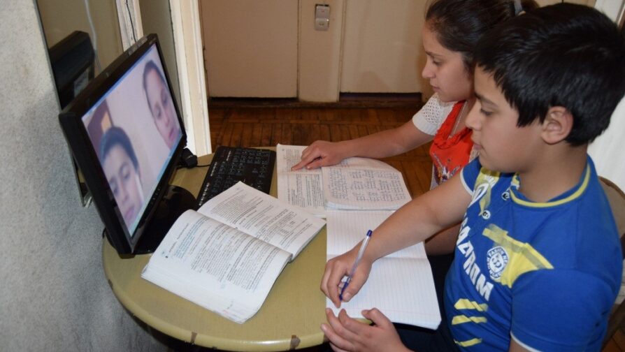 Salpie and Sahag absorbed in their online class on Zoom. Photo by UNHCR