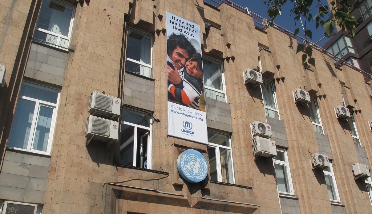 UN House with UNHCR poster