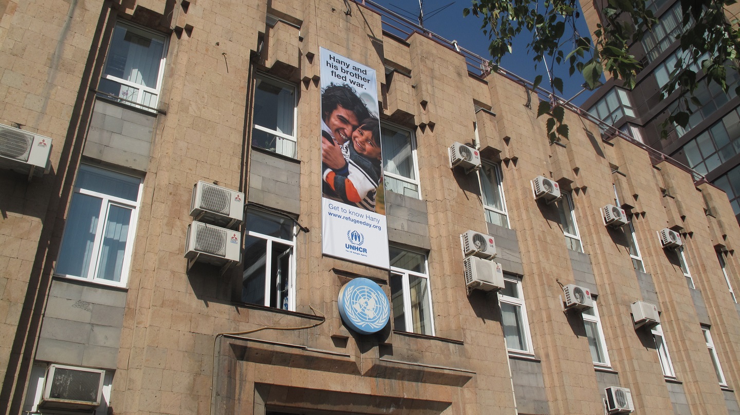 UN House with UNHCR poster
