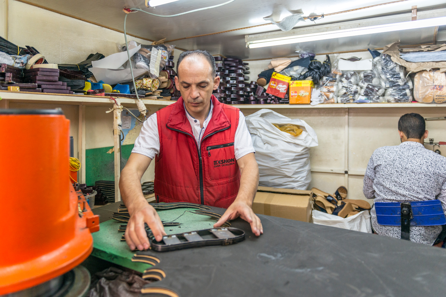A Syrian refugee and a shoemaker in his thriving workshop in Casablanca after winning a first prize for the most successful enterprising refugee project