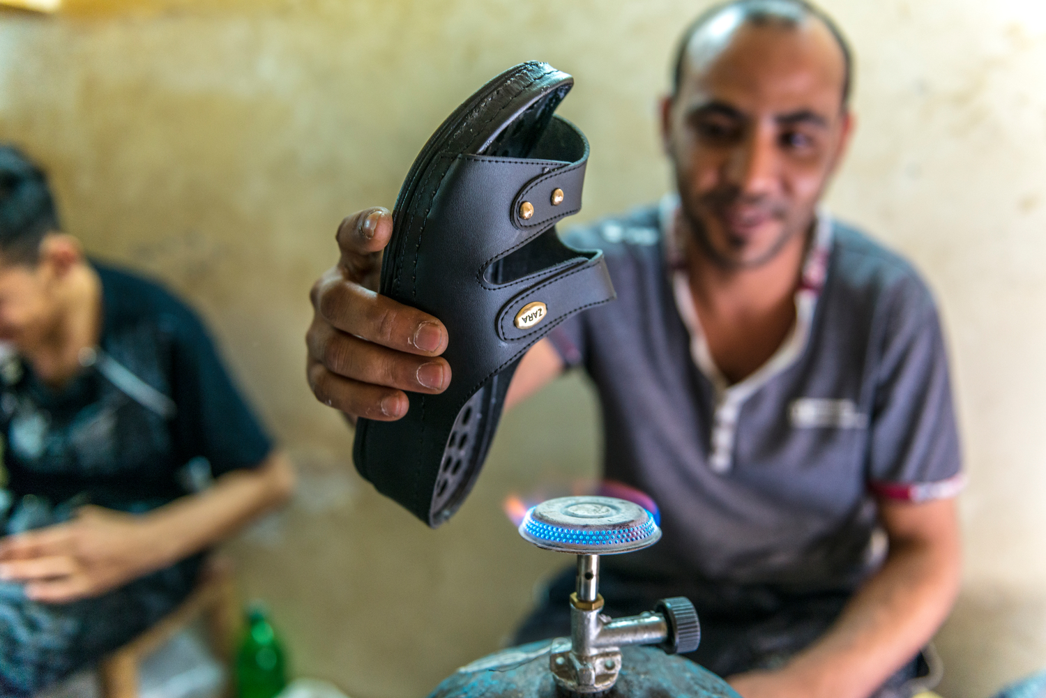 A Syrian refugee and a shoemaker in his thriving workshop in Casablanca after winning a first prize for the most successful enterprising refugee project