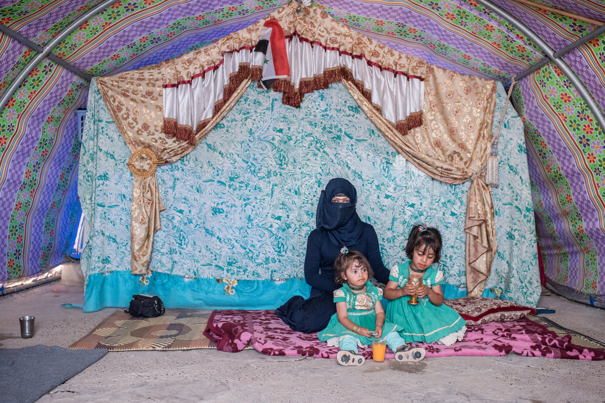 Iraq. People adjusting to life after losing their husbands and fathers.