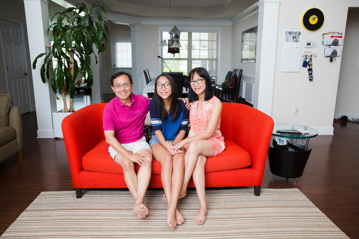 United States. Portrait of Thanh Dang and his family at their home.