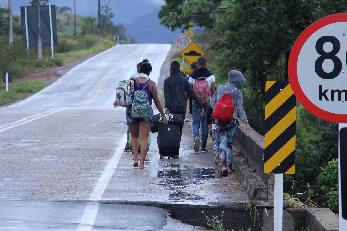Brazil. Venezuelans walk on the road from Pacaraima to Boa Vista