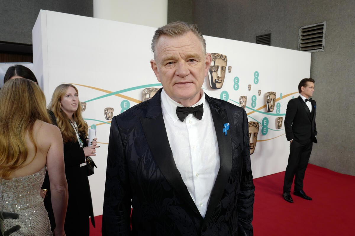 United Kingdom. Actor Brendan Gleeson wearing a blue ribbon in solidarity with refugees at the EE BAFTA Film Awards 2023