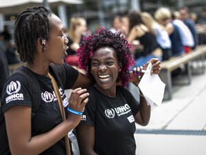 UNHCR, the UN Refugee Agency - Two participants from the Step with Refugees challenge are laughing and enjoying each others company on the Free University of Berlin Campus. 