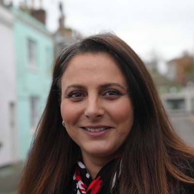 A woman standing in the middle of a street