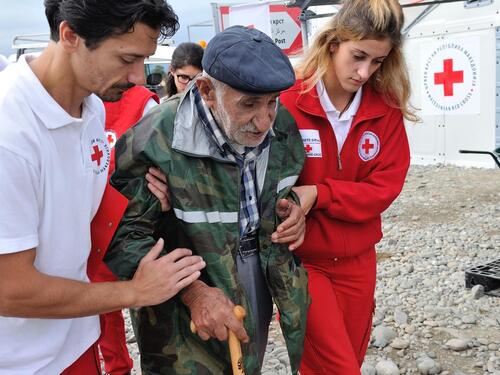 The Former Yugoslav Republic of Macedonia. Syrian refugee, Ismail Ibrahim assisted by the Red Cross at Vinjug Reception Centre