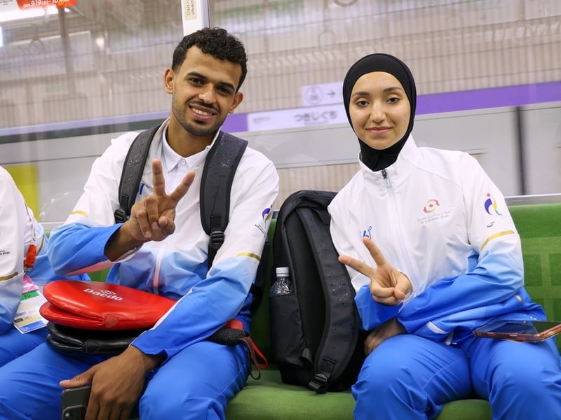 Mahmoud and Tala on the subway in Nagoya, Japan.