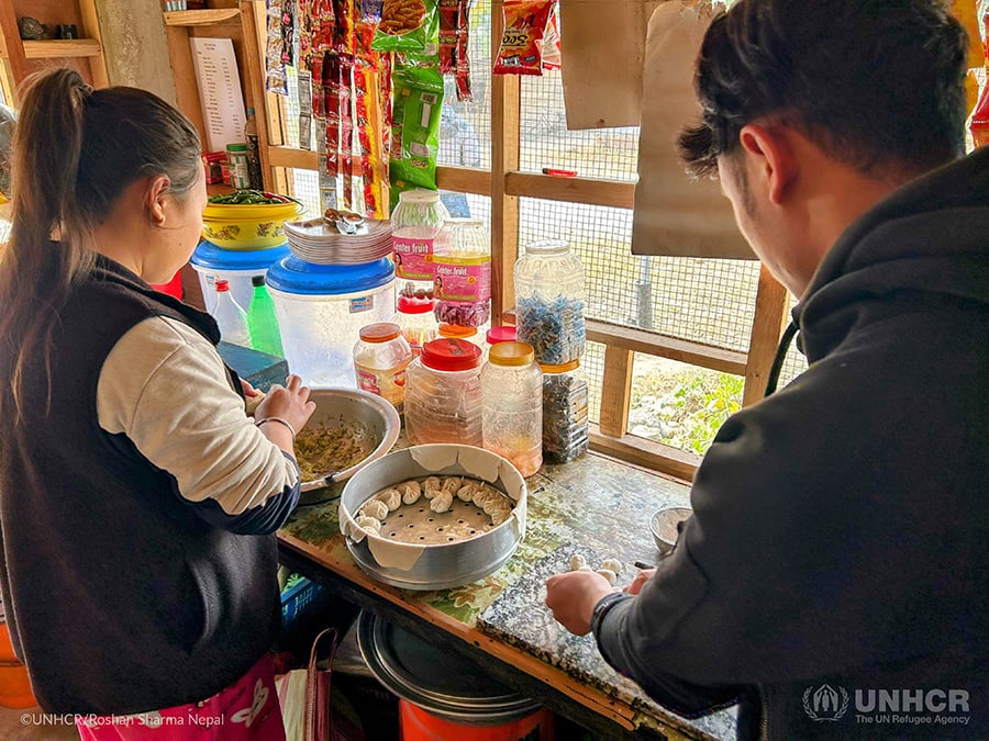 Gunaraj&rsquo;s younger sister and brother prepare dumplings.