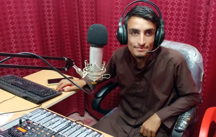 Izatullah Nizami in the studio recording content. 