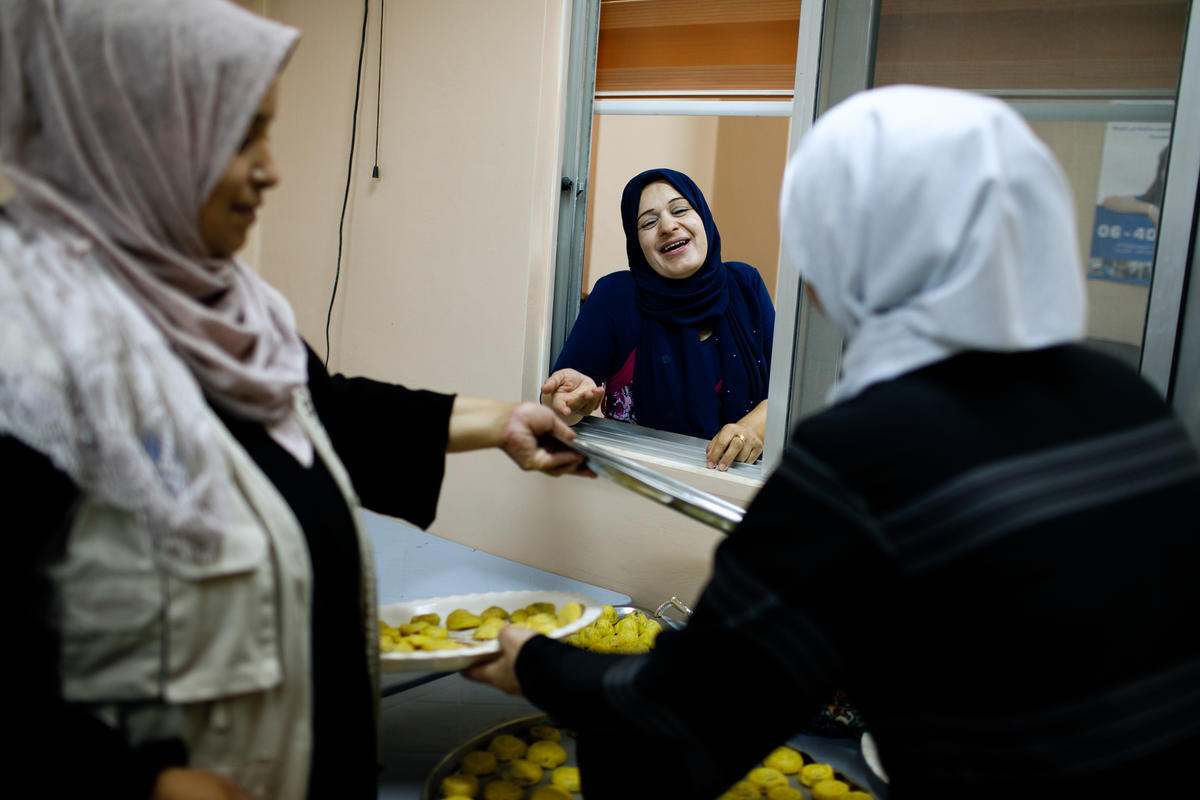 Jordan. A group of refugee women make sweets for Eid and distribute to needy families