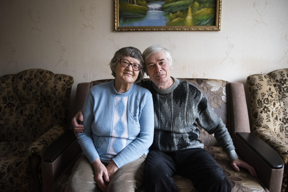 Ukraine. Internally displaced persons sit in the living room of the apartment they are renting on the government-controlled side of the Donbas area