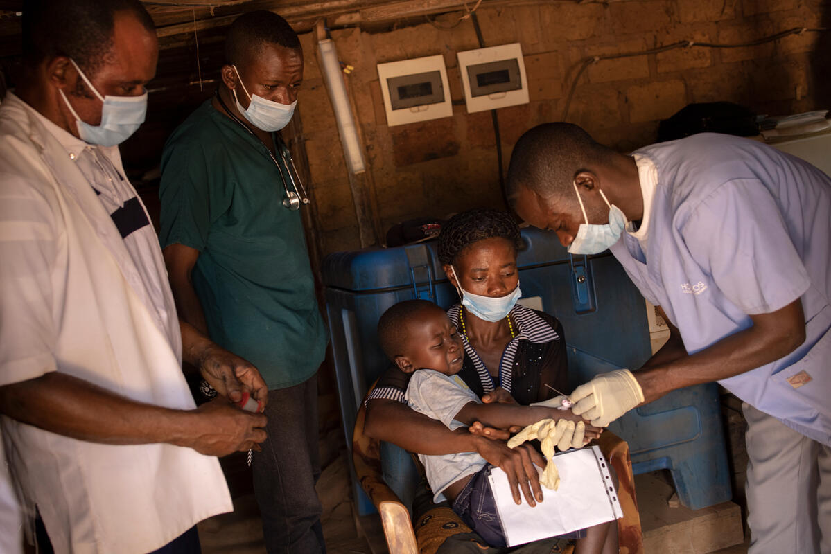 Democratic Republic of Congo. CAR refugee woman and son at health center