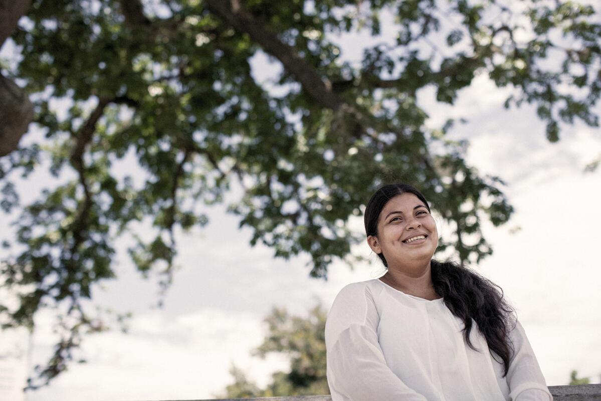 Elsa* tries to make the best out of a difficult situation. Here, she breaks out her best smile for the camera.